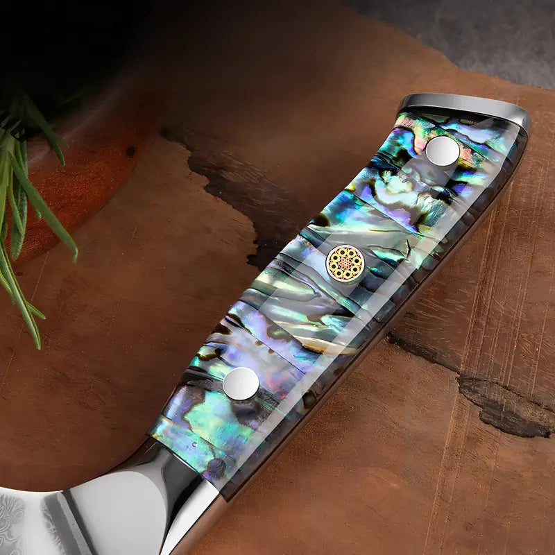 Zoom sur le manche du Gyuto Lame Céleste, en résine nacrée multicolore, finition lisse et brillante.