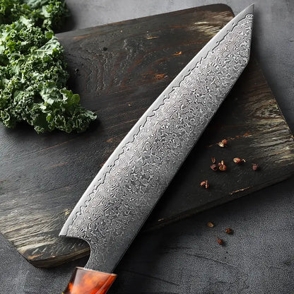 Kiritsuke Chef du Clan placé à côté d’ingrédients frais, lame damas bien mise en valeur.
