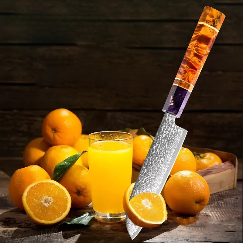 Couteau d’office Fleur du Katana présenté avec des oranges entières et du jus fraîchement pressé, ambiance cuisine naturelle.